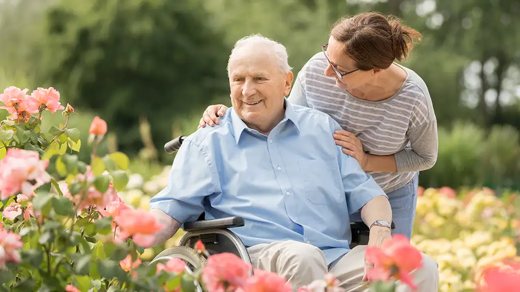 Man and care giver in garden